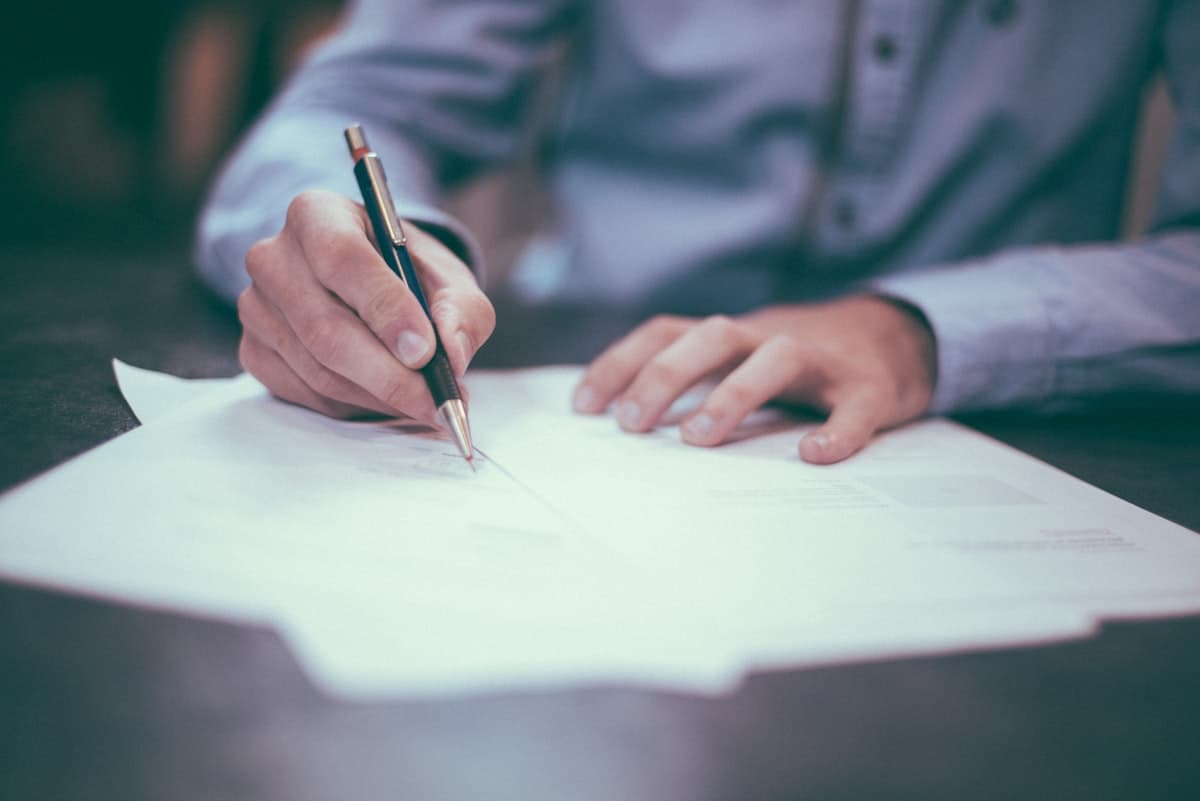 Organized documents and a pen on a desk, ready for trust planning.